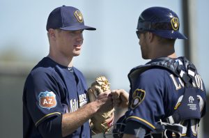  "Catcher Jonathon Lucroy congratulates his brother in Christ after a Brewer win."